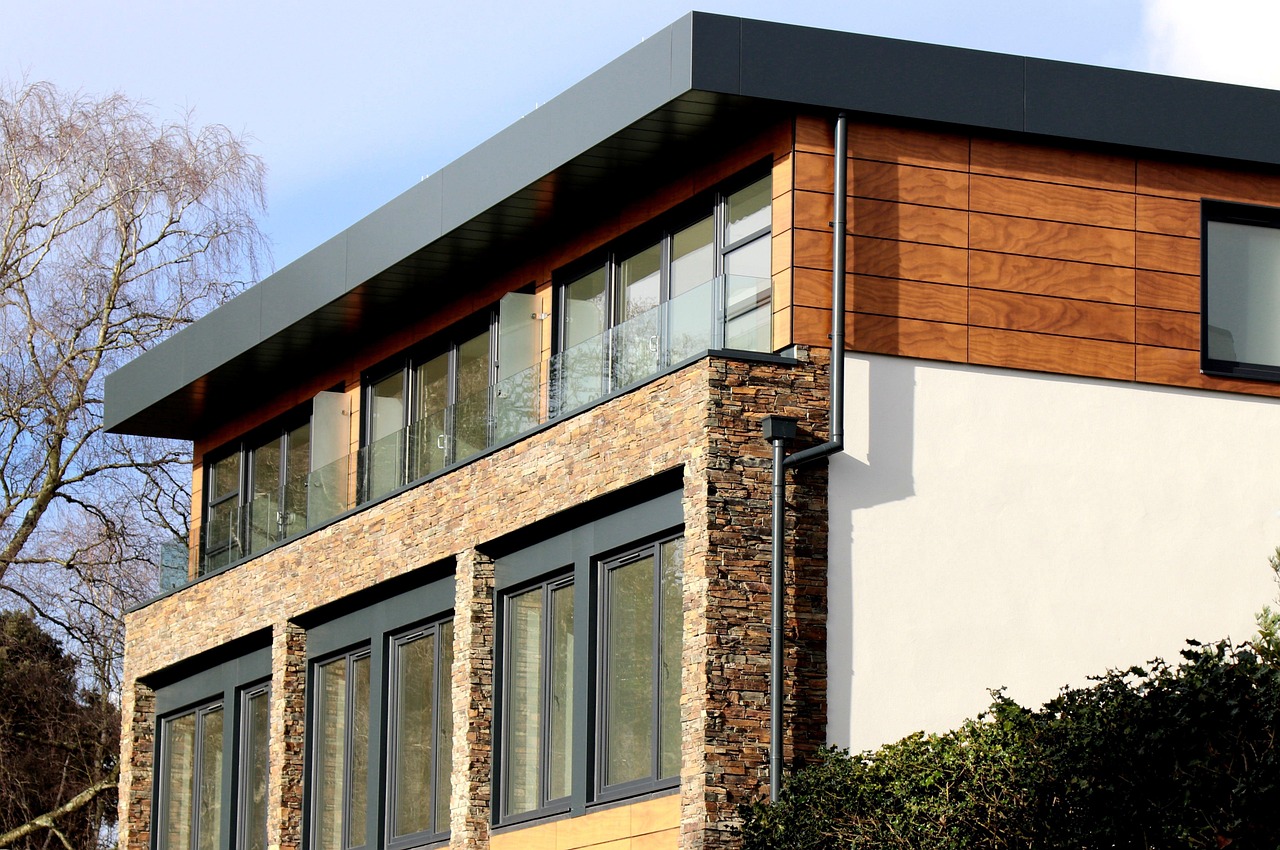 Contemporary custom residence with stone facade and large glass windows