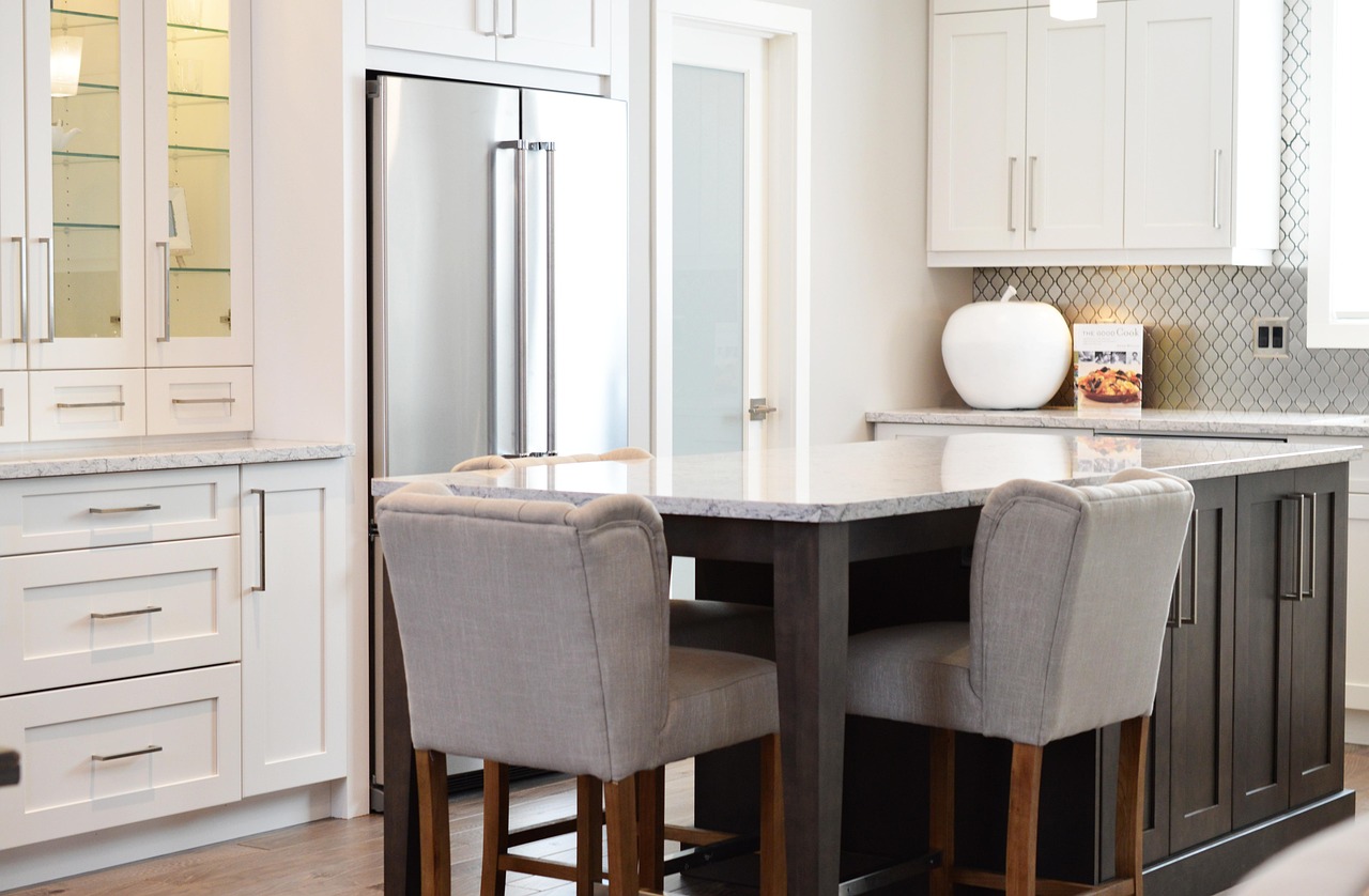 Renovated kitchen with marble surfaces and bespoke cabinetry